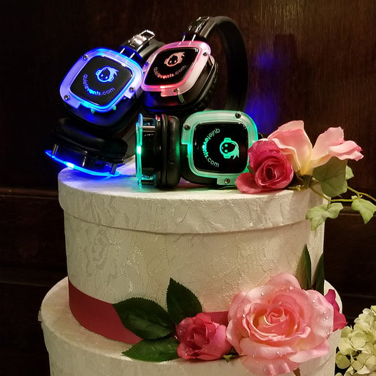 Quiet Events Silent Disco headphones for wedding. A picture of a two level cake with headphones as the center piece.