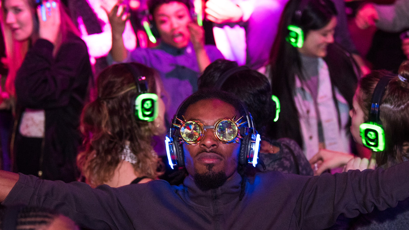 Outdoor event using silent disco headphones to reduce noise in a city setting