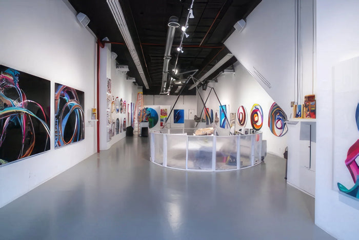 Quiet Events Silent Disco headphones for galleries.  A space with various pictures on the walls.