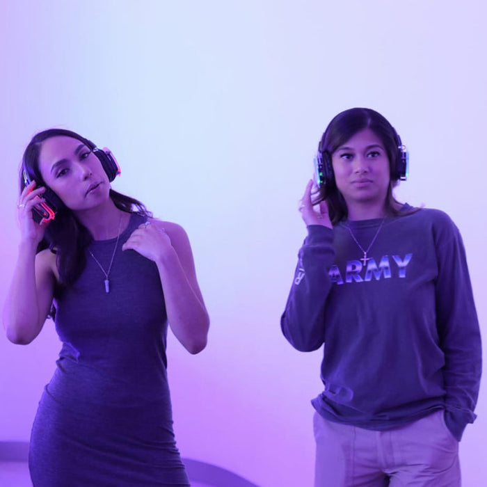Quiet Events Silent Disco headphones for guided tours.  Two young girls listening attentively with headphones.