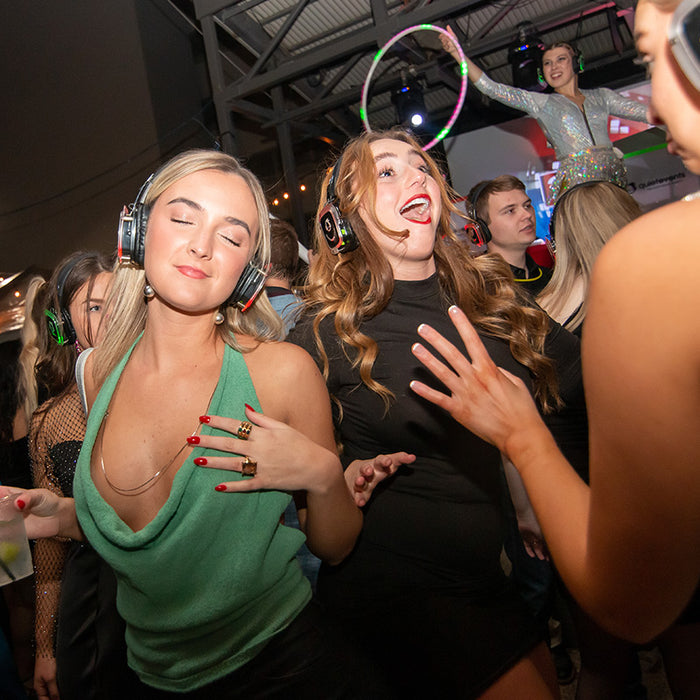 Quiet Events Silent Disco headphones for New York.  A group of girls dancing having fun enjoying themselves in a party atmosphere wearing headphones.