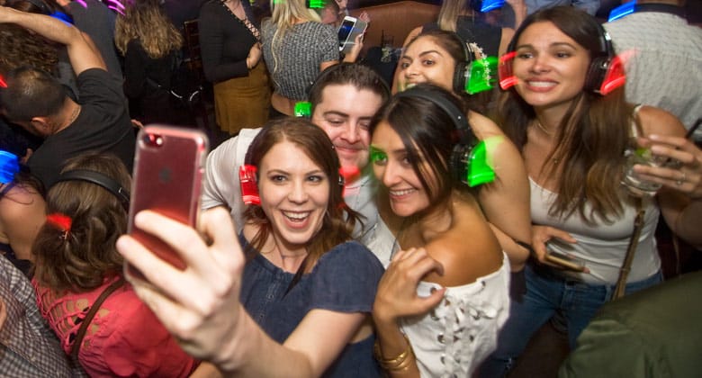 Selfie wearing headphones at silent disco party