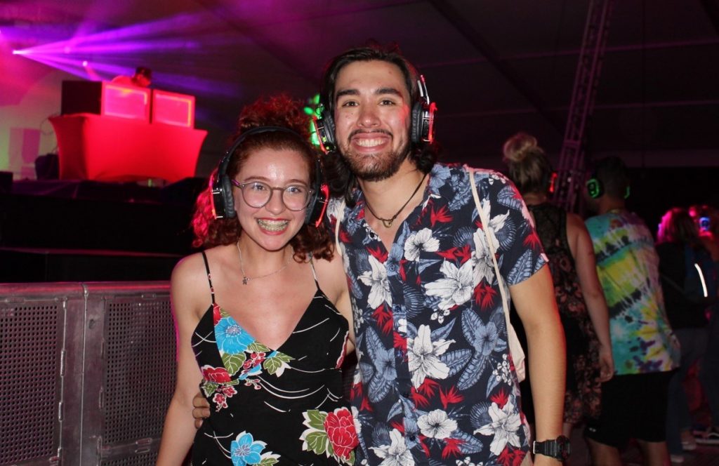 Couple in Hawaiian dress with headphones