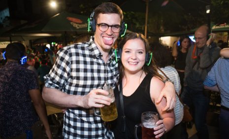 Couple with beer in outdoor silent party