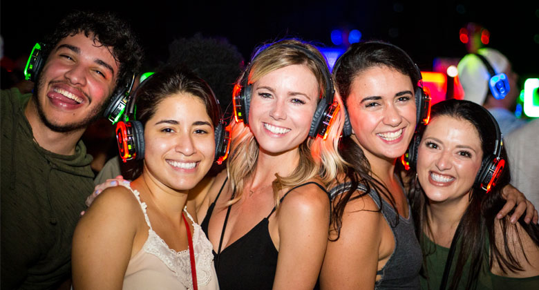 Best friends enjoying the party with headphones