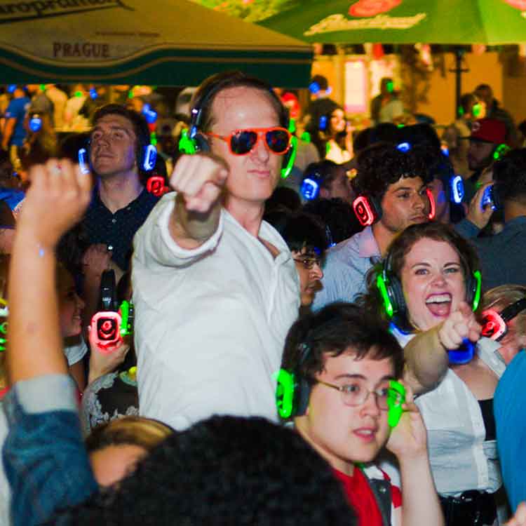 Man pointing with glowing headphones