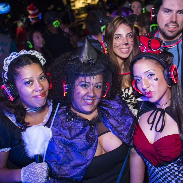 Group of woman in Halloween costumes at a silent disco