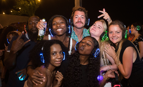Group of friends at a silent disco at Focal Point Beer Co